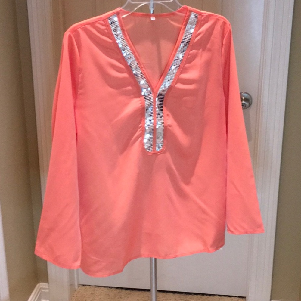 Very sheer orange blouse